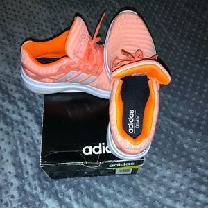 Woman’s Adidas ortholite sneakers.